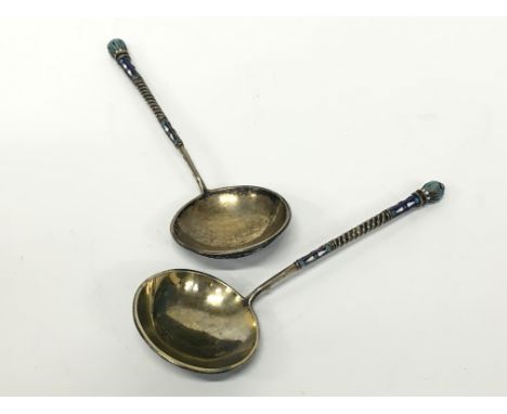 A pair of gilded silver and enamel Cloisonne decorated Russian ladles with circular finials. Condition Report 7.5 inches. 160