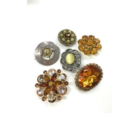 A silver and citrine hallmarked brooch together with five other vintage brooches.