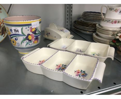 A small Poole Pottery planter decorated in the YO pattern together with two hors d'oeuvre trays and a cheese dish.