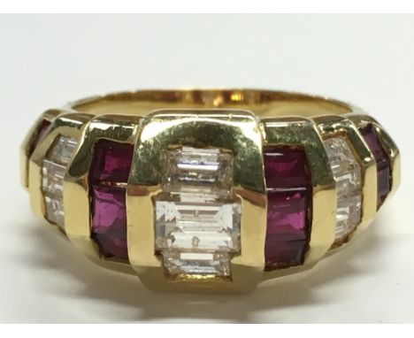 An 18 carat gold ruby and diamond ring, size M.