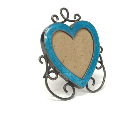 A miniature silver and blue enamel heart shaped photograph frame by Gourdel Vales & Co.