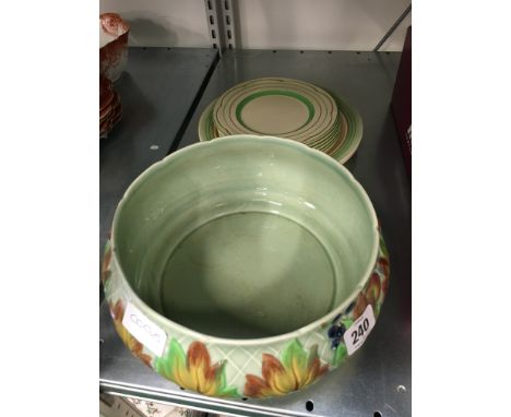 A Clarice Cliff fruit bowl decorated with Autumn Leaves together with a set of six Clarice Cliff Newport Pottery side plates 