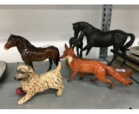 A Beswick black china model: Black Beauty & Foal together with a brown glazed Exmoor Pony, glazed Fox and small Beswick Terri