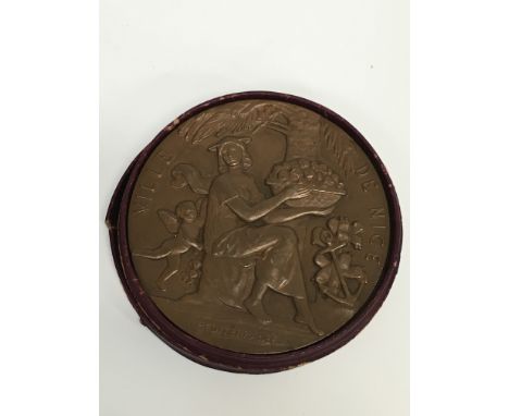 A 1949 bronze medallion awarded by the Committee of The Fetes Des Arts Des Sports Nice; a 1949 automobile medal depicting a f