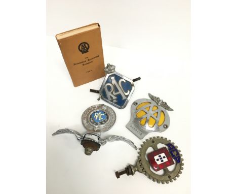 Four various car badges including an RAC bonnet badge with wing mount, an ACP enamel car badge and two others together with a