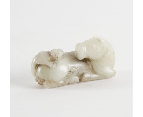 A CHINESE MING STYLE JADE `HORSE AND MONKEY GROUP'Carved with the monkey clambering up the hind quarters of the recumbent hor