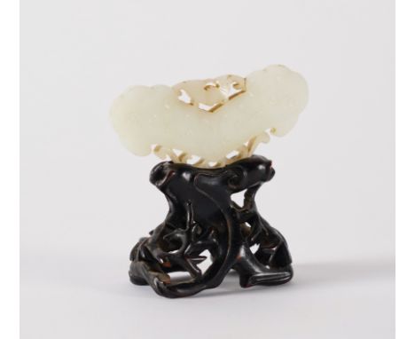 A CHINESE WHITE JADE PENDANT  (2)In the form of a chime, carved with classic scrolls and surmounted by a bat, 8.25cm wide, wo