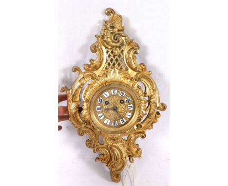 French ormolu carte clock, the circular dial with Roman enamel plaques.