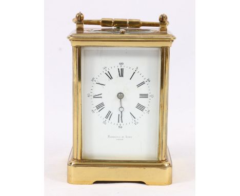 French brass repeating carriage clock, retailed by Marshall & Sons, with enamel Roman dial, striking on a coiled gong, 17cm. 