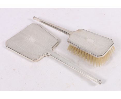 Art Deco engine turned silver hand mirror and hair brush, Birmingham 1947, 28.5cm. (2)