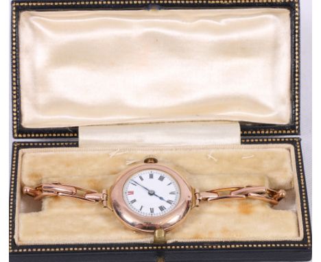 1940's ladies 9ct gold wristwatch, with Roman enamel dial, later crown, expanding bracelet.