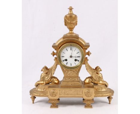 19th century French gilt metal mantel clock, with urn finial above an enamel Roman dial supported by griffons, with Japy Frer