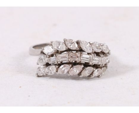 18ct white gold diamond ring set with baguette and marquise diamonds in three rows, 5.4g, size R.