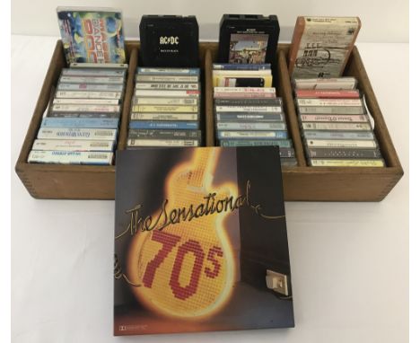 A tray of approx. 50+ assorted vintage cassette tapes. To include: 2 AC/DC 8 track cassettes, Boomtown Rats, Billy Joel and S
