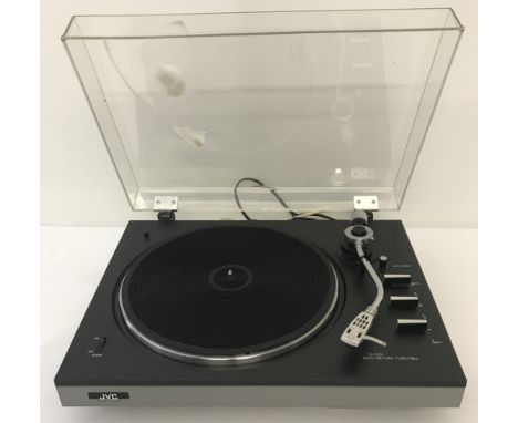 A vintage JVC JL-A 20 Auto-Return turntable record player.