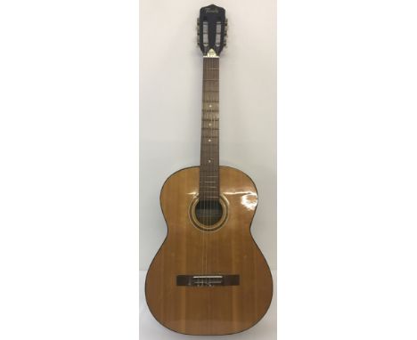 A vintage Terada 6 string acoustic guitar with steel reinforced neck.No. C 305.