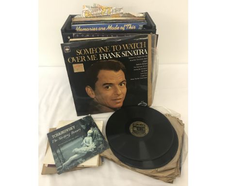 A collection of vintage vinyl LP's, 78's and 7" singles in a black record case. To include: Frank Sinatra, Jerry Lee Lewis, T