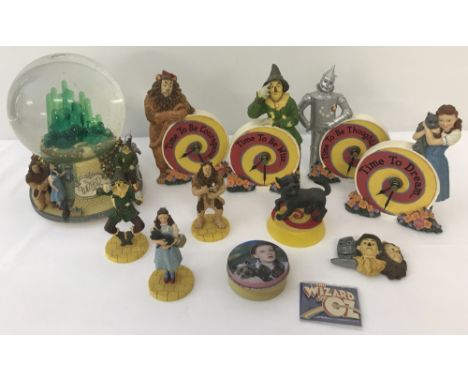 A small quantity of The Wizard of Oz collectable resin ornaments. To include: The San Francisco Music Box Company snow globe 
