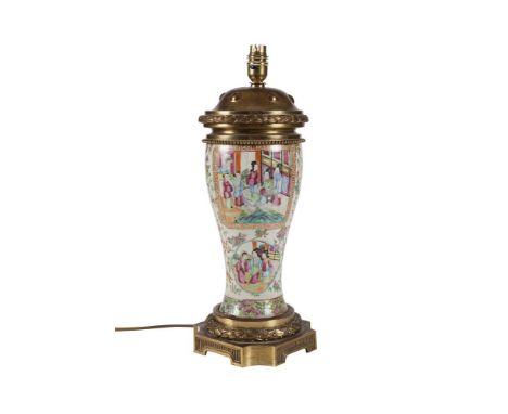 A CANTON FAMILLE ROSE CIRCULAR BALUSTER COLUMN TABLE LAMP, mounted with cast gilt brass platform base and circular top with w