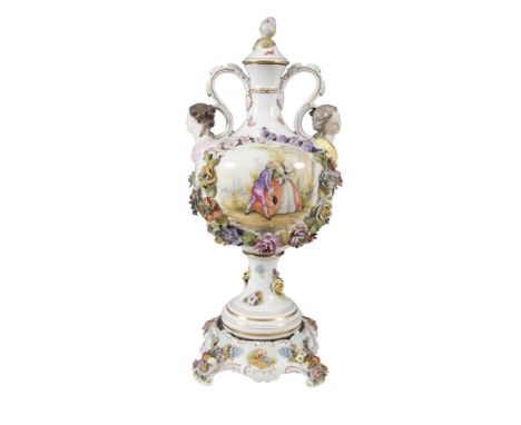 A LARGE DRESDEN PORCELAIN BALUSTER VASE, of circular baluster form, with flower head finial lid above twin handles set with h