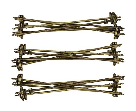 A SET OF SEVENTEEN BRASS STAIR RODS AND FITTINGS, each of tubular rod with pointed finial to each end. 68.5cm wide 