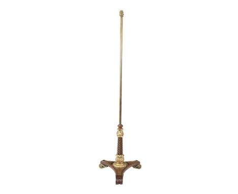 A REGENCY ROSEWOOD AND BRASS POLE SCREEN / STANDARD LAMP, adapted for electricity, the triangular platform base with parcel g