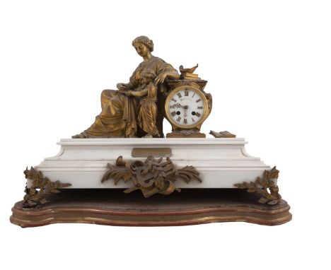 A FRENCH WHITE MARBLE AND ORMOLU FIGURAL MANTEL CLOCK, 19th century signed Waterhouse and Company, surmounted with female cla