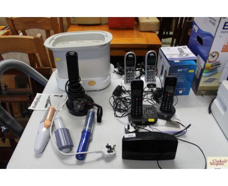Two sets of BT cordless telephones, a Phillips radio alarm clock, a Tommy Tippee steriliser and a collection of hair straight