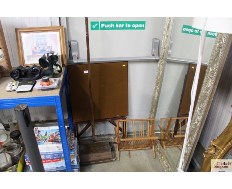 A folding card table; a magazine rack and a Ewbank carpet sweeper