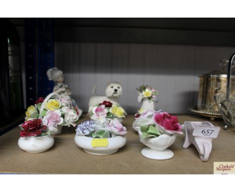 A collection of floral encrusted ornaments; blue and white figurine AF and a model dog