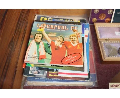 A collection of football memorabilia including Liverpool and 1966 World Cup 