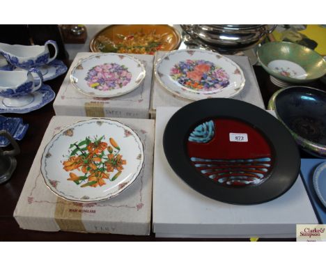 A Poole Pottery limited edition Millennium plate and three Royal Albert collectors plates