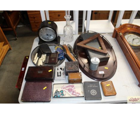 A Bakelite cased single hole mantel clock; a Waterford crystal glass decanter and stopper; an oak gallery tray; various woode