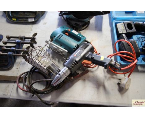 A Black and Decker heat gun, Black and Decker jigsaw and an inspection light