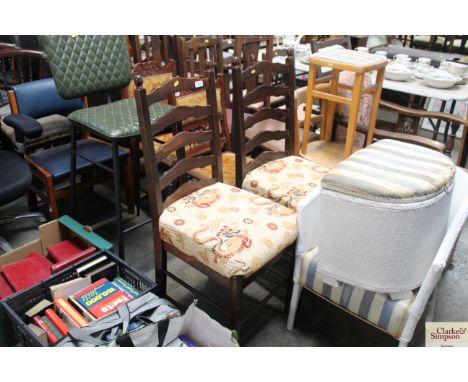 A pair of oak ladder back dining chairs