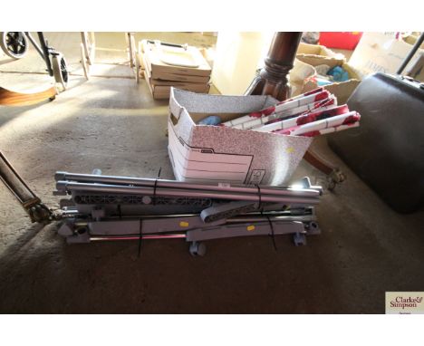Three modern clothes rails and a box of flower-decorated roller blinds