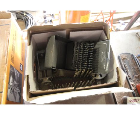 A box containing drill bits; lathe attachments etc