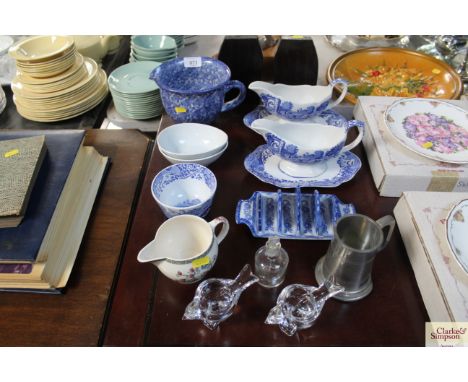 A collection of various patterned blue and white china to include Spode, Italian and Indian Tree patterned jugs, toast rack, 