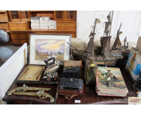 A Box Brownie camera, a Voitlander camera, a wooden truncheon, pair of opera glasses, flat iron, model galleon, collection of