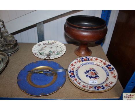 A stoneware pedestal bowl; a Copeland plate; two Imari patterned plates; a Wedgwood plate and a knife and fork