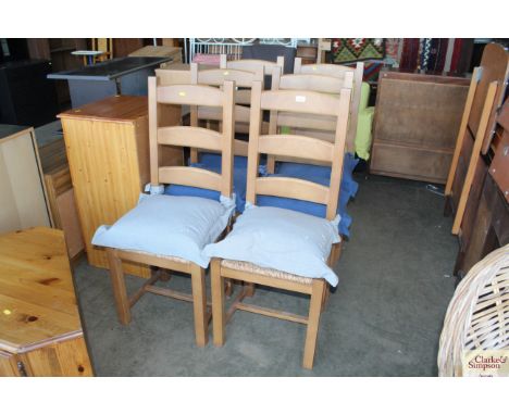 A set of six modern rush seated, ladder back chairs
