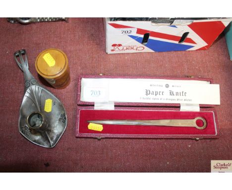 A Sterling silver paper knife in the form of a Georgian meat skewer in fitted case; a Mauchline ware box and cover and an Art