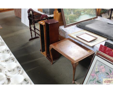 A coffee table raised on cabriole supports, two CD racks and a towel rail