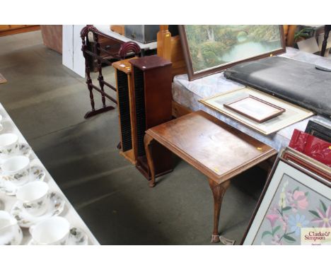 A coffee table raised on cabriole supports, two CD racks and a towel rail