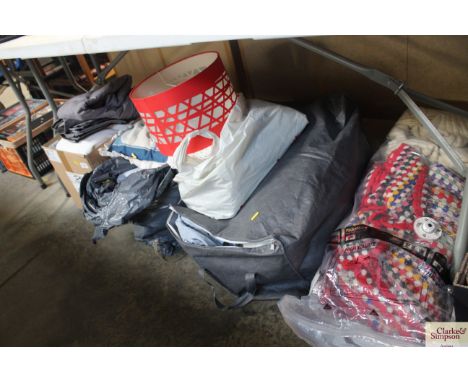 A collection of various linen; material; duvet covers; bed throws; light shade etc