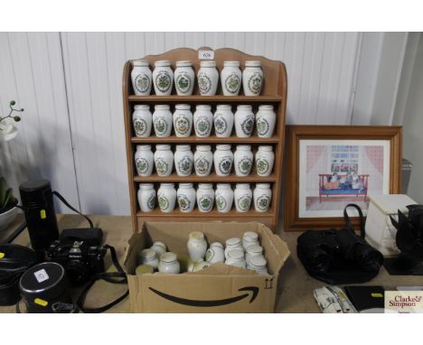 A spice rack and a collection of spice jars