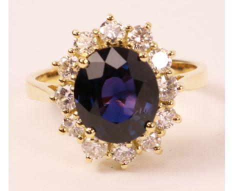 Violet sapphire and diamond cluster yellow gold ring hallmarked 18ct, sapphire approx 3 carat   Condition Report   Click here