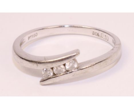 Platinum ring set with three diamonds stamped PT950