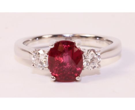 Oval ruby and round brilliant cut diamond three stone white gold ring hallmarked 18ct, ruby approx 2 carat Condition Report C