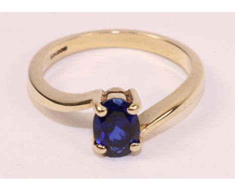 Single stone sapphire gold cross-over ring hallmarked 9ct   Condition Report   Click here for further images, condition, auct